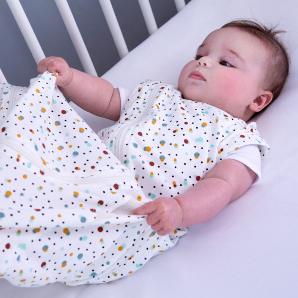 Baby in scandi spot Purflo baby sleep bag in cot