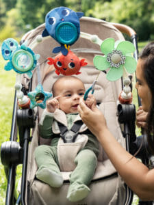 Baby activated propeller spins when baby pulls the handle supporting cognitive development