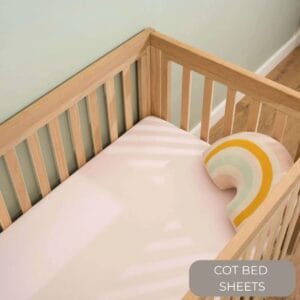 Cot bed sheets button